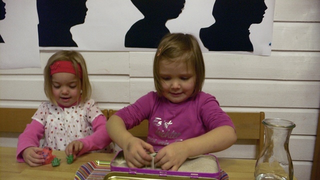 Carla and Mia searching for frogs